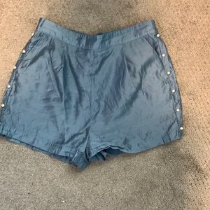 Blue silky dress shorts with pearls down the seam